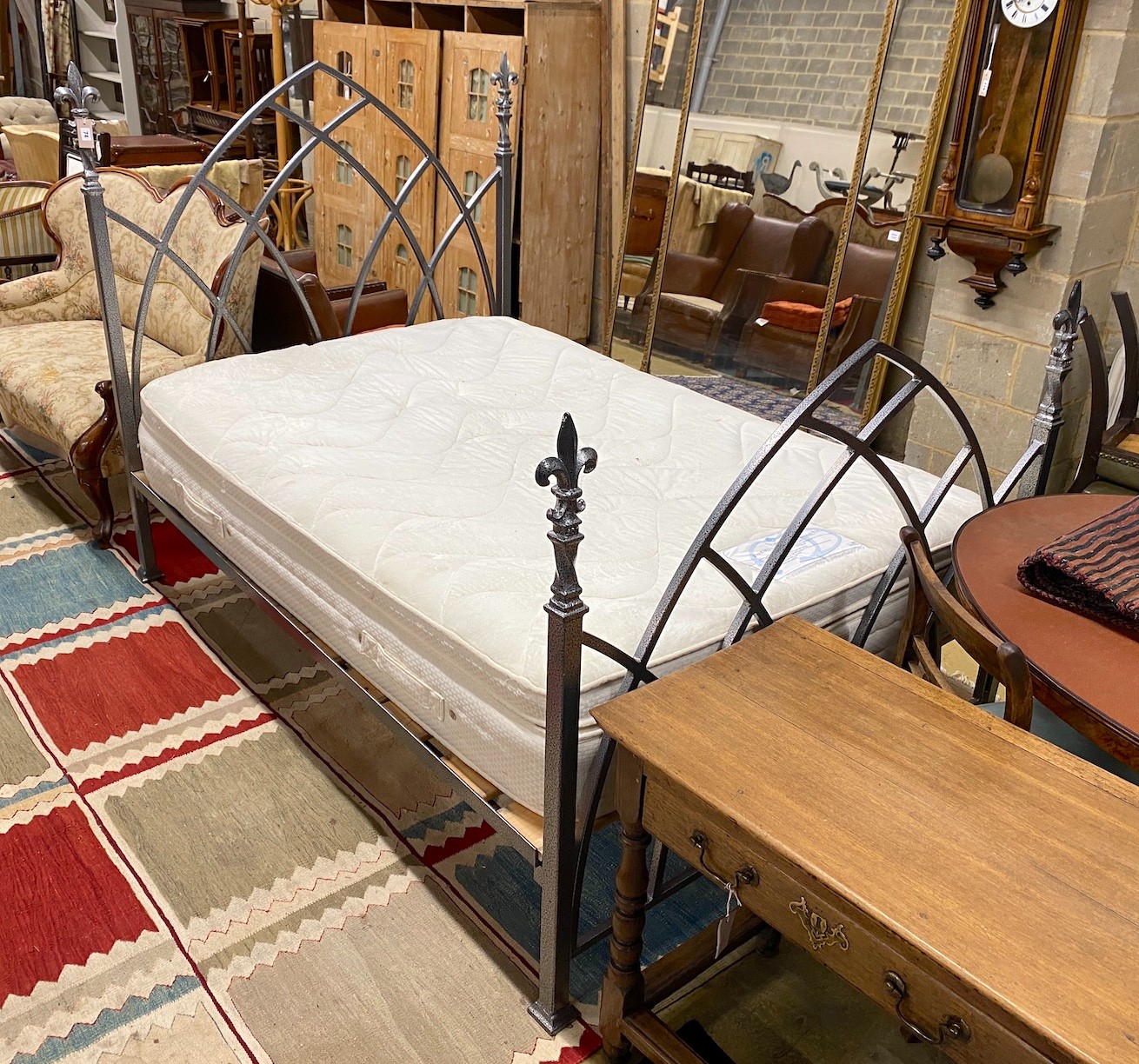 A Gothic style wrought iron double bedframe with Dorlux Topaz mattress, width 138cm, length 202cm, height 146cm